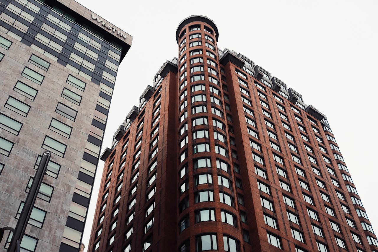 Upward view of tall modern buildings showcasing urban architecture.
