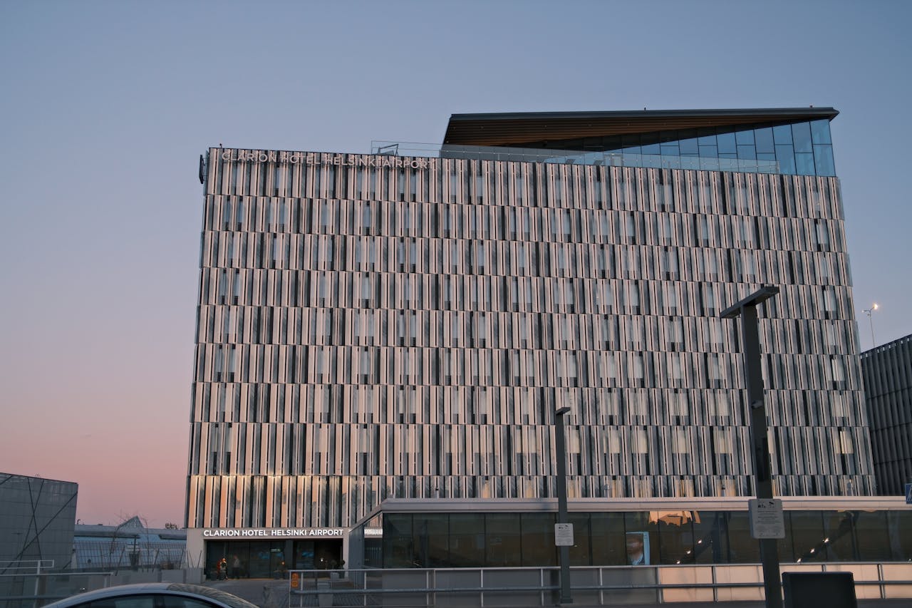 Stunning view of Clarion Hotel Helsinki Airport with evening sky colors.